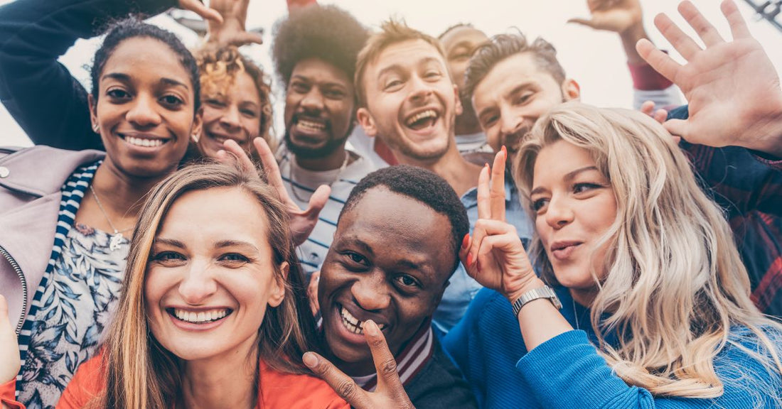 genuine people group of friends smiling making goofy gestures showing authentic selves