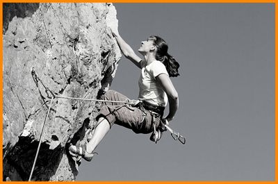 woman rock climbing